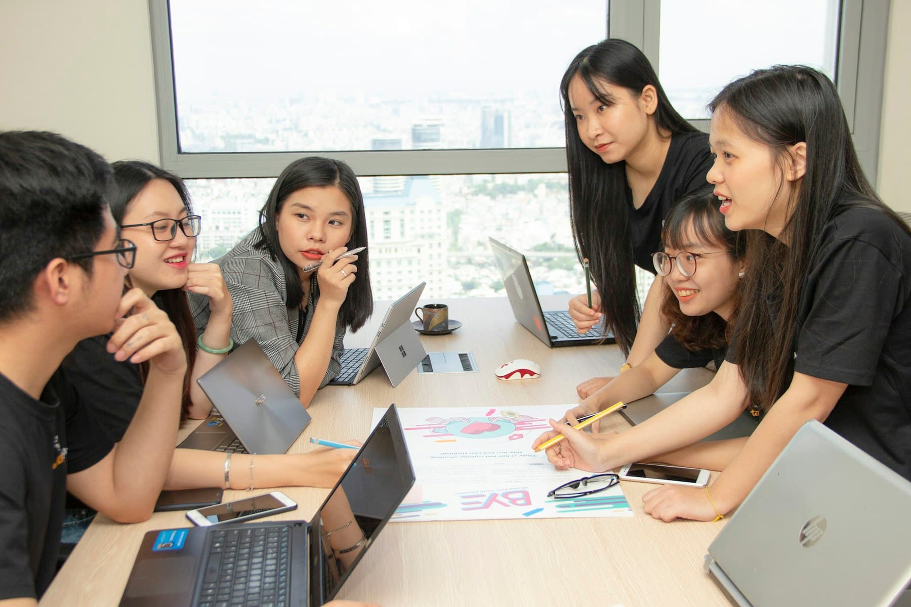 Asian colleagues planning a digital marketing campaign together