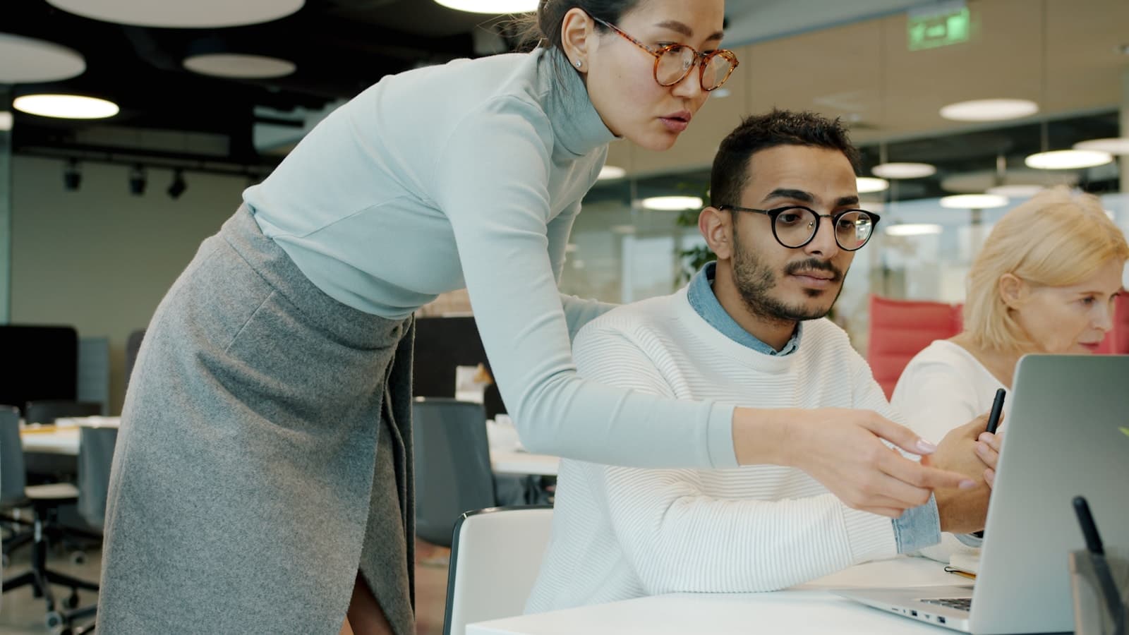 Colleagues working through a business decision together
